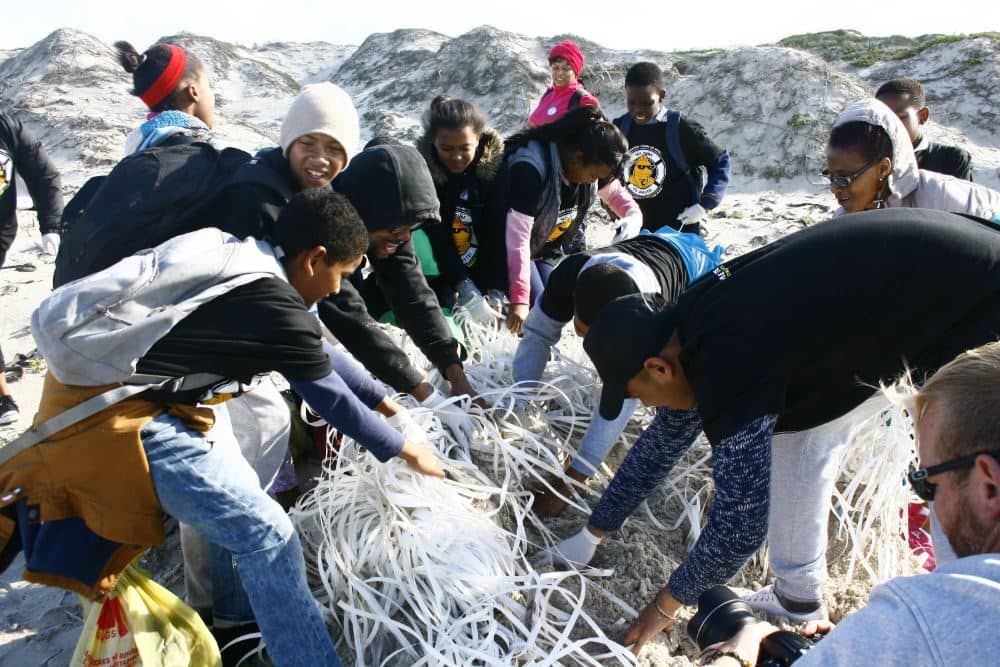 Volunteers on Strandfontein Beach PHOTOGRAPHER: RYCHERDE WALTERS