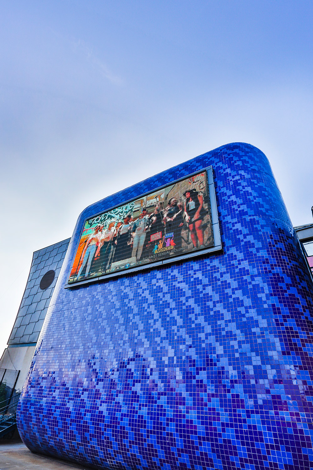 Soweto Theatre in Soweto exterior cladding facade tile adhesives still bond. Outdoor screen